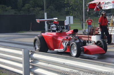Red Altered Drag Car Launching Red Altered Drag Car Launching